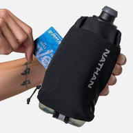 Nathan Speed Draw 2 Flask 18oz black with ergonomic no-slip grip, easy-squeeze bottle, phone and zippered pockets for running storage.