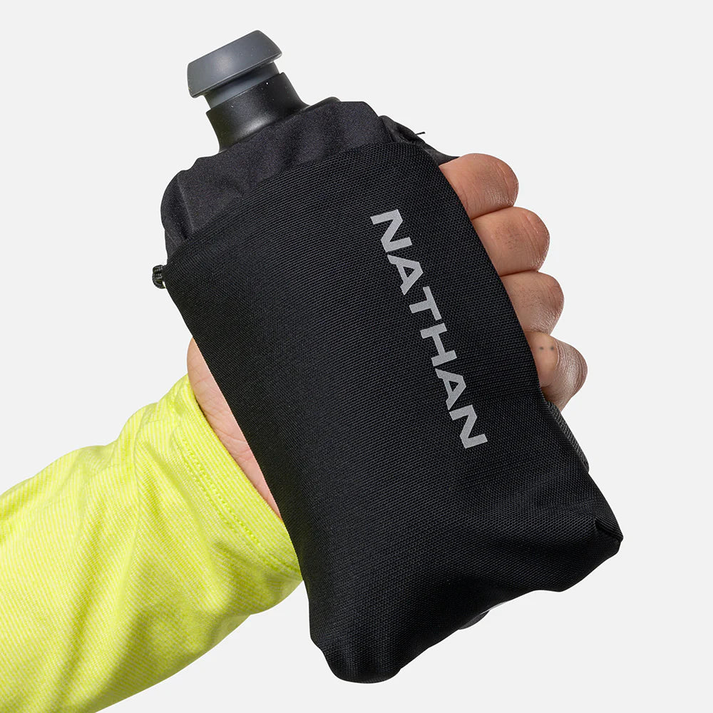 Hand holding black Nathan SpeedDraw 2 Flask 12oz with ergonomic grip, power mesh pocket, and zippered storage for running in Canada