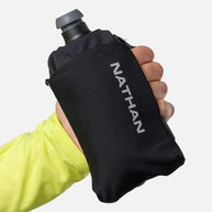 Hand holding black Nathan SpeedDraw 2 Flask 12oz with ergonomic grip, power mesh pocket, and zippered storage for running in Canada