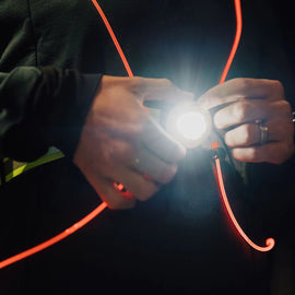 Rechargeble LED Safety Vest by NiteVest in black with red trim, featuring 150 lumen chest light and 360-degree illumination for safety