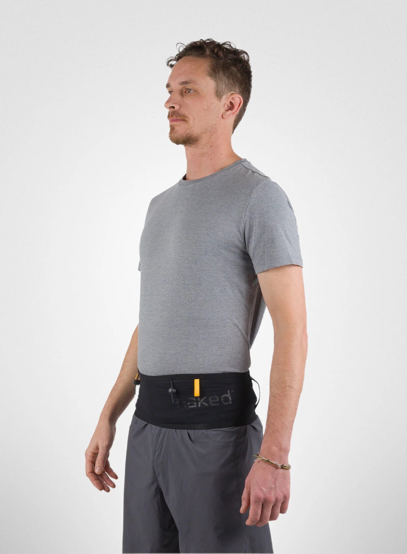 Running Band by Naked in black waist belt designed for carrying fuel, fluids, and accessories during running and outdoor activities