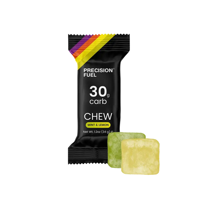 PF 30 Chew by Precision Fuel & Hydration in black packaging with mint and lemon chews, high carb energy nutrition for running and travel