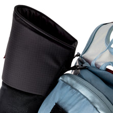 Close-up of the padded top opening of the UltrAspire Pole Quiver in Black mounted beside a running vest