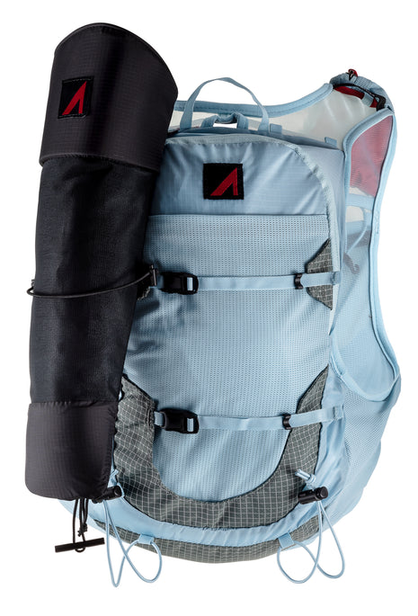 UltrAspire Pole Quiver in Black attached to the side of a light blue running vest