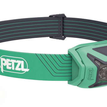 Actik Lamp by Petzl in green and grey, lightweight headlamp with 450 lumens for running, trekking, and mountaineering safety
