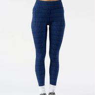 Low Light Speed Tights - Women by Rabbit in navy with 360° reflective print, compressive fit, laser-cut perfs, and five pockets for running safety and comfort