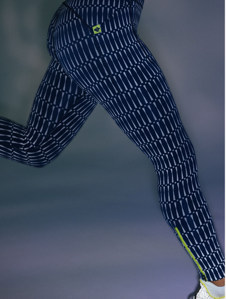 Low Light Speed Tights - Women by Rabbit in navy with 360° reflective print, compressive fit, laser-cut perfs, five pockets for safe running