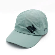 Elite Hat by Rabbit in moonlight blue with baseball cap bill, laser-cut vents, lightweight wicking fabric for sun and gear protection.
