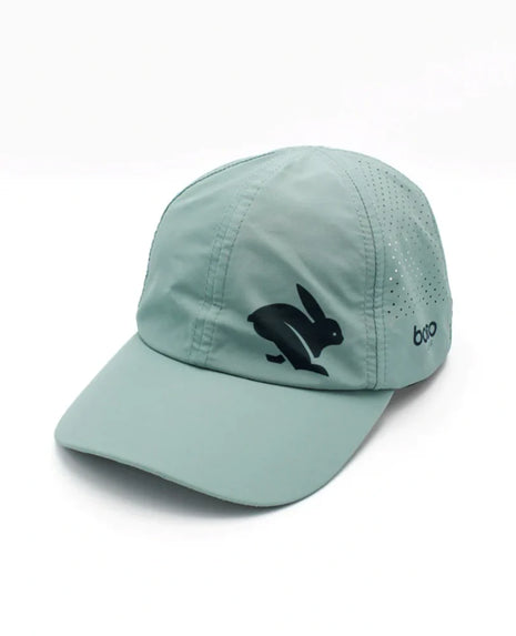 Elite Hat by Rabbit in moonlight blue with baseball cap bill, laser-cut vents, lightweight wicking fabric for sun and gear protection.