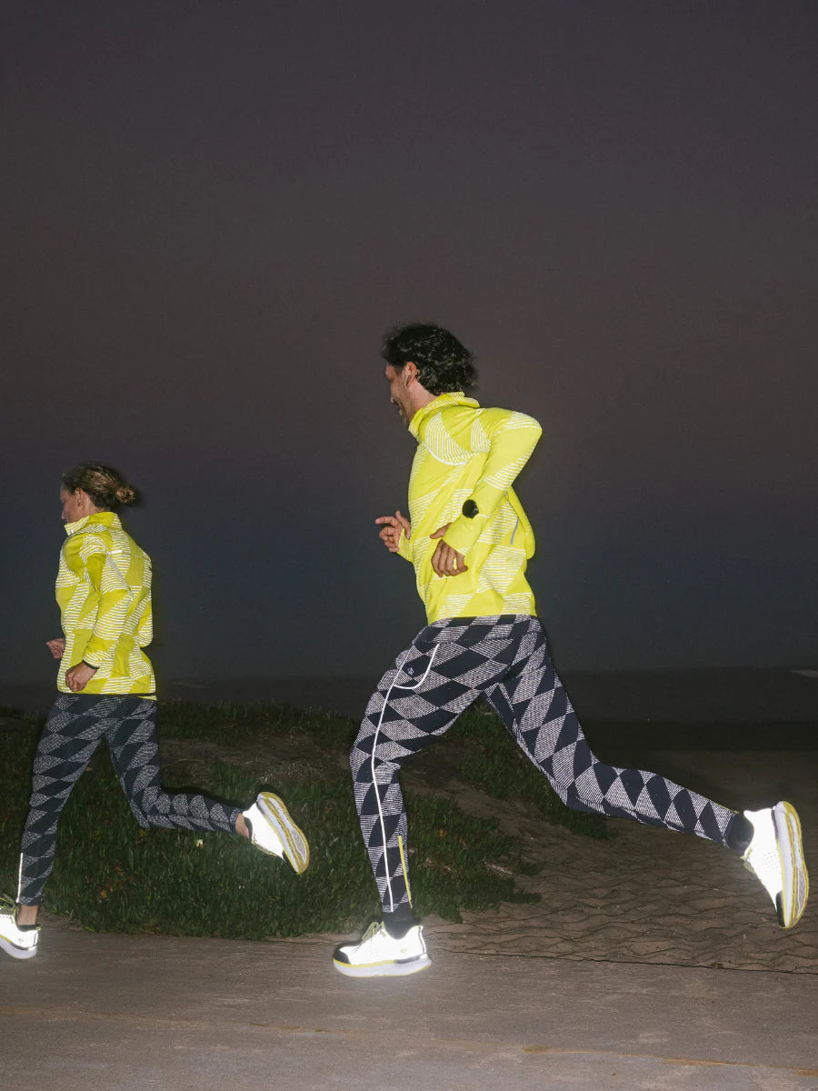 Low Light Pocket Tightz - Men by Rabbit in black and grey with 360° reflective print and pockets, midweight for running safety and warmth