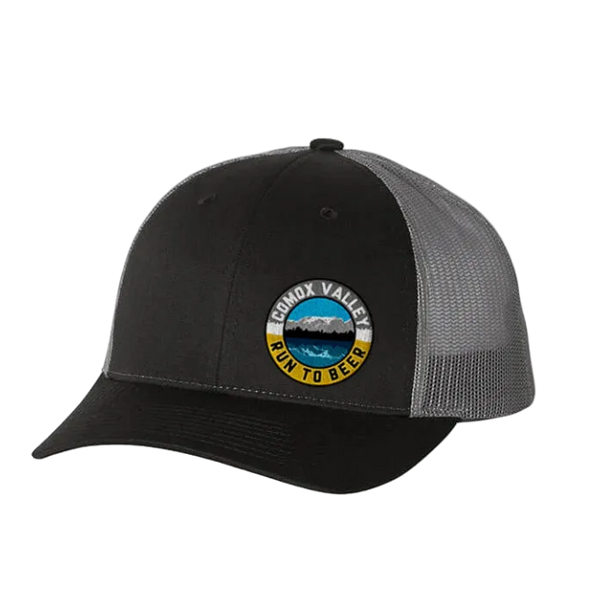 Run to Beer Hats (2025) trucker cap in Black/Charcoal with Comox Valley Run to Beer round patch, front three-quarter view