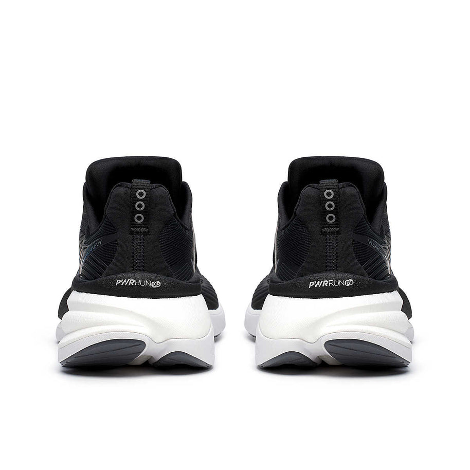 Hurricane 24 - Women by Saucony in black and white, max cushioned running shoe with dual-foam for road running and comfort