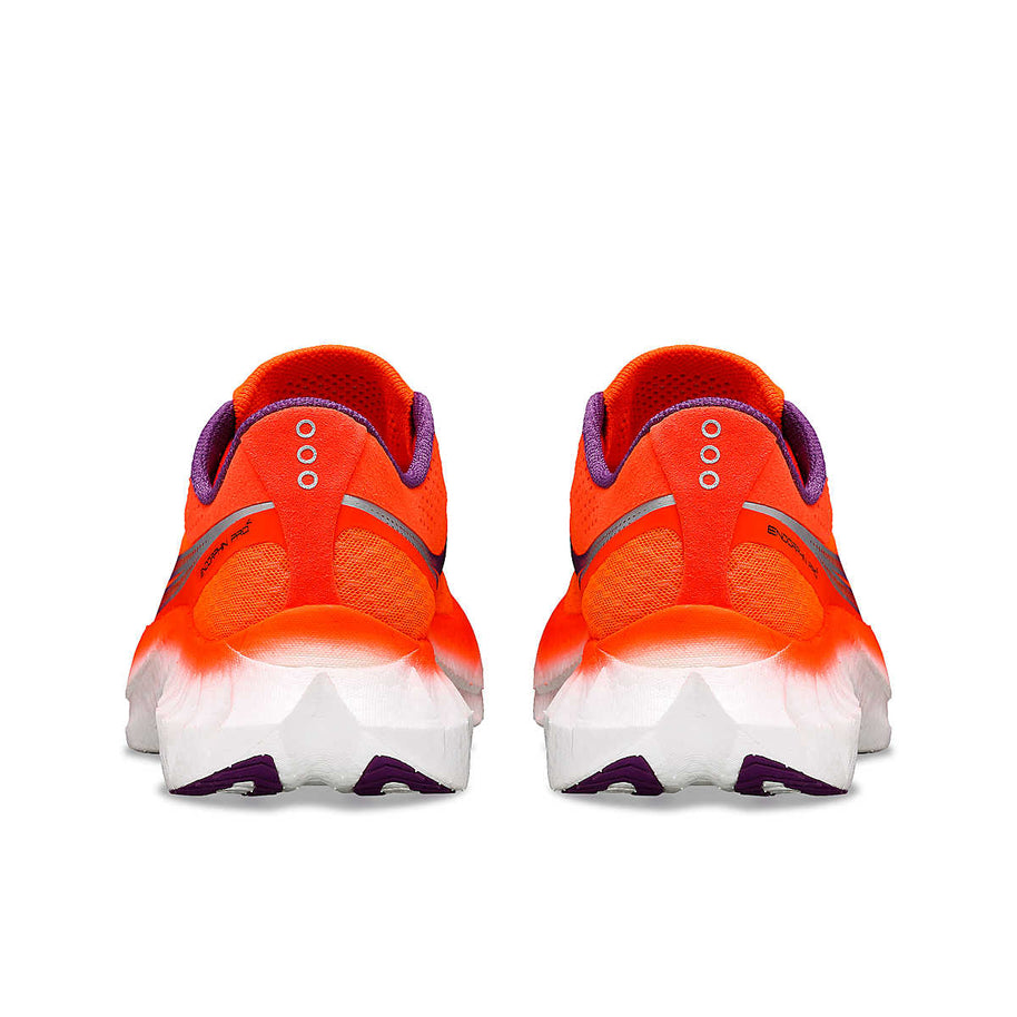 Endorphin PRO 4 - Women by Saucony in bright orange and purple, responsive road running shoes for long-distance performance