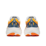 Saucony Triumph 22 - Women running shoes in orange and navy, featuring enhanced foam for joyful long-distance running and comfort.