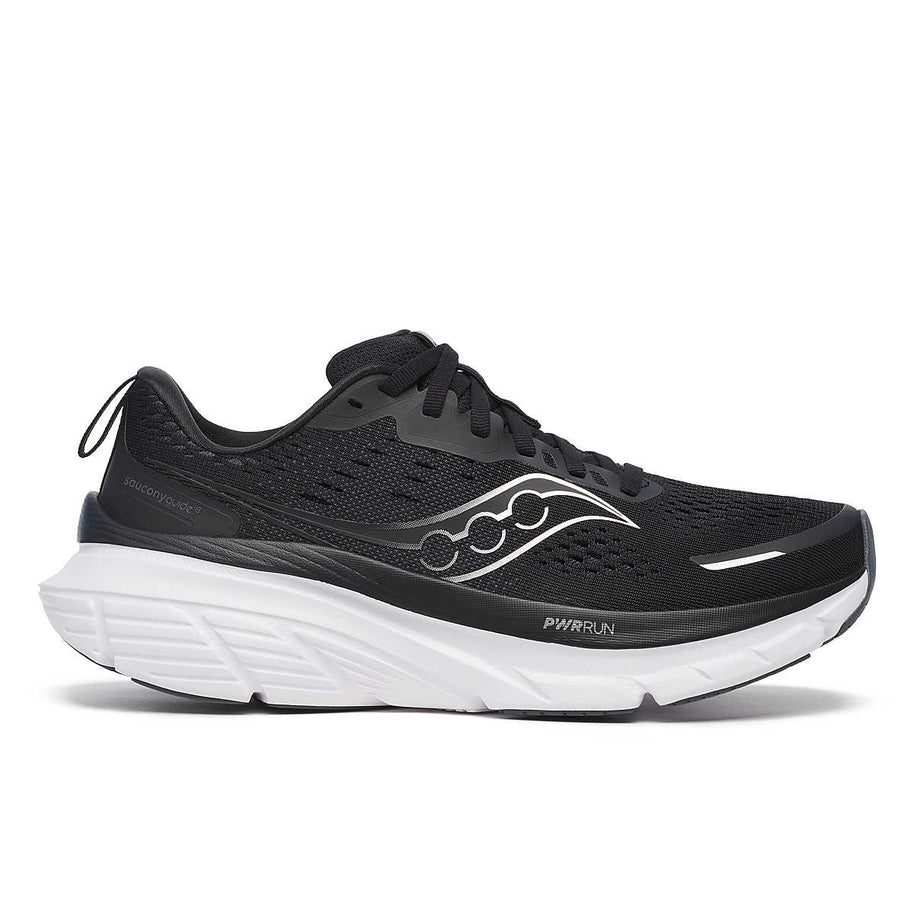 Guide 18 Wide - Women by Saucony in black with white midsole, cushioned running shoe with PWRRUN and CenterPath for road running