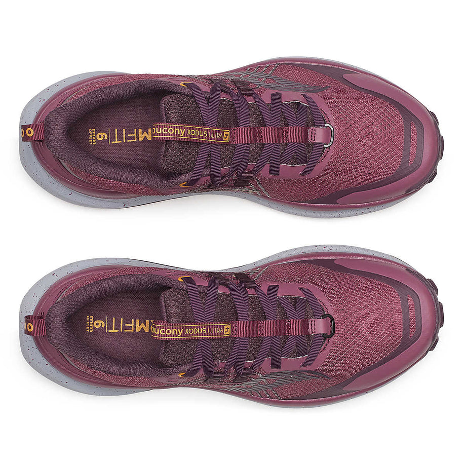 Xodus Ultra 4 - Women by Saucony in burgundy and grey, max cushioned trail running shoe with unmatched grip for long-haul outdoor use