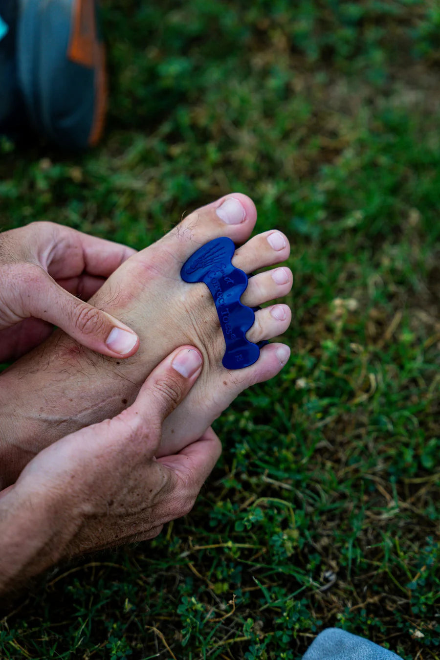 Correct Toes Sport in blue by Correct Toes, toe spacer designed to restore natural toe alignment and improve foot muscle strength for sports