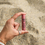 CocoBalm Lip Balm by Sun Bum in pink, moisturizing lip care with coconut oil and aloe vera for smooth, hydrated lips