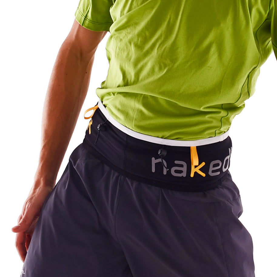 SL Running Band by Naked in black with orange accents, lightweight waist belt designed for carrying essentials during shorter runs like 5Ks and half marathons