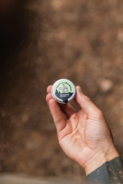 All Natural Anti-Chafe Salve (Metal Tin) by Squirrel's Nut Butter in green and black, natural skin protector for chafing and blisters