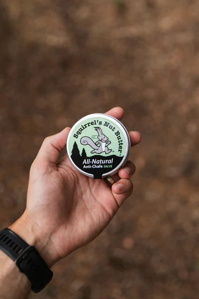 All Natural Anti-Chafe Salve (Metal Tin) by Squirrel's Nut Butter in green and silver, natural skin protection for chafing and blisters