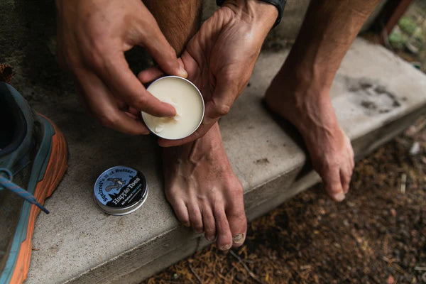 Happie Toes Blend (Metal Tin) by Squirrel's Nut Butter in black tin, foot salve for restoring damaged skin, eco-friendly 2 oz container