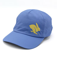 Elite Hat by Rabbit in blue with yellow logo, lightweight woven cap with laser-cut vents for ventilation and sun protection