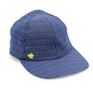 Low Light Tech Cap by Rabbit in navy blue with reflective pattern, designed for visibility in the dark, unisex running cap