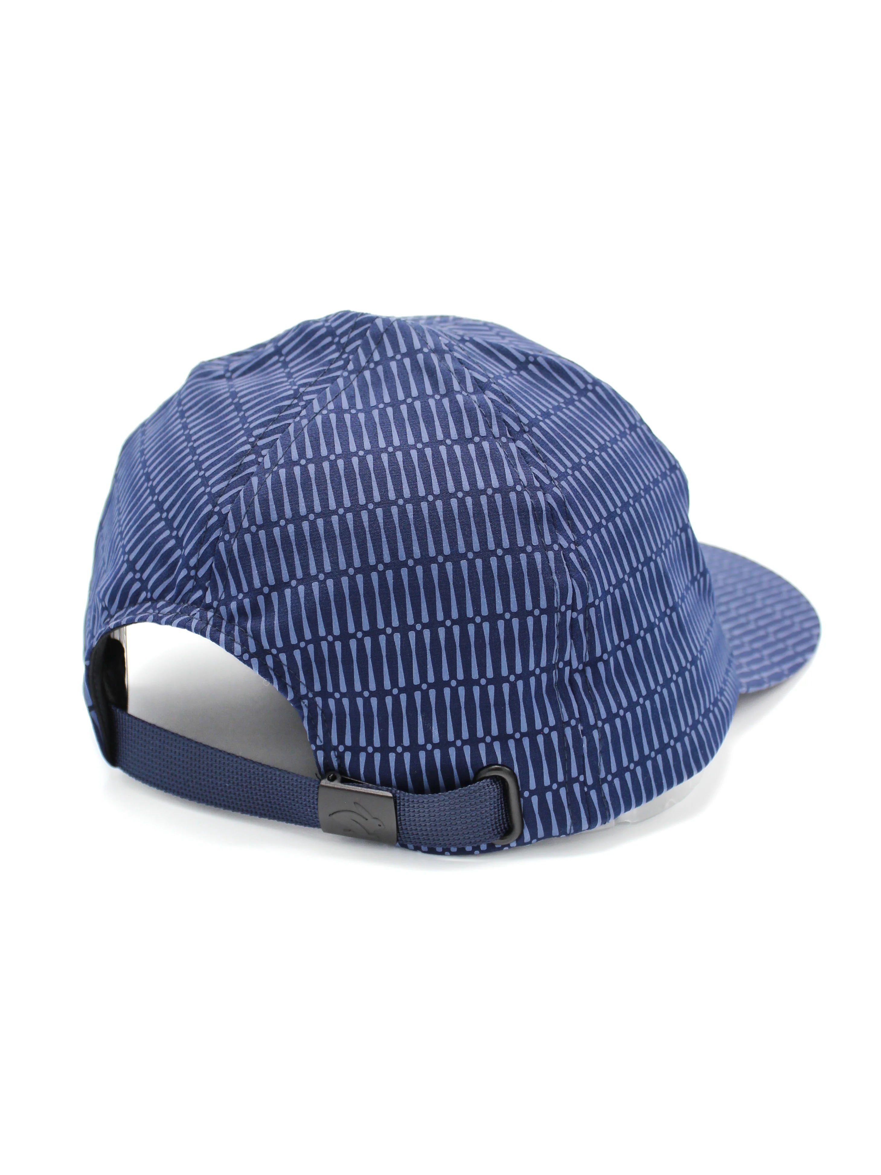 Low Light Tech Cap by Rabbit in navy with reflective pattern, adjustable fit, designed for visibility and safety in low light conditions