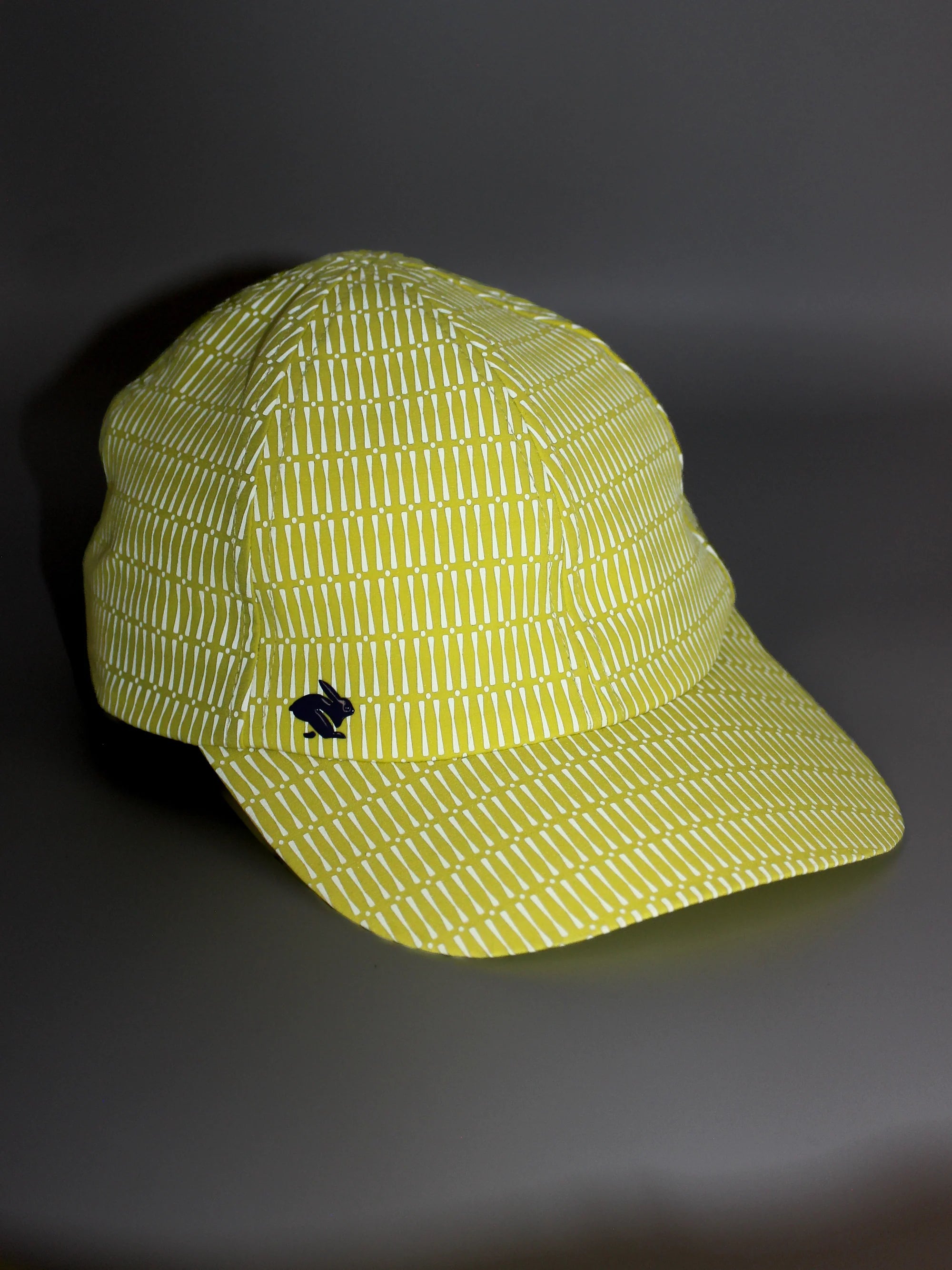 Low Light Tech Cap by Rabbit in yellow with white pattern, lightweight cap designed for visibility and safety in low light conditions
