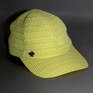 Low Light Tech Cap by Rabbit in yellow with white pattern, lightweight cap designed for visibility and safety in low light conditions