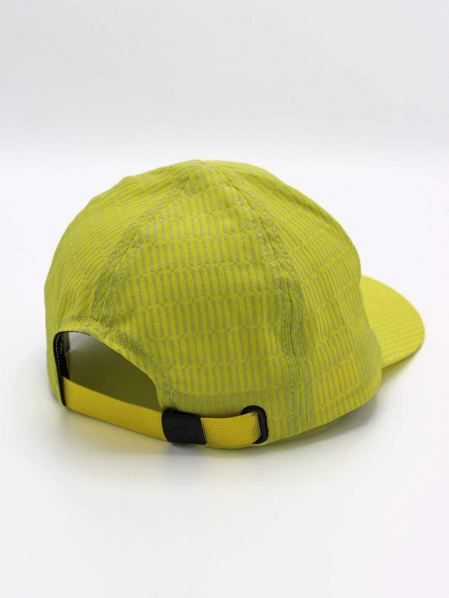 Low Light Tech Cap by Rabbit in bright yellow with reflective details, adjustable fit, designed for visibility and safety in low light conditions