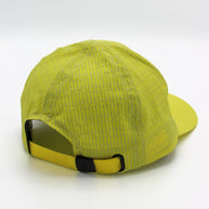 Low Light Tech Cap by Rabbit in bright yellow with reflective details, adjustable fit, designed for visibility and safety in low light conditions