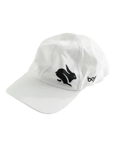 Elite Hat by Rabbit in white with black logo, lightweight wicking cap with ventilated laser-cut vents for sun and gear protection