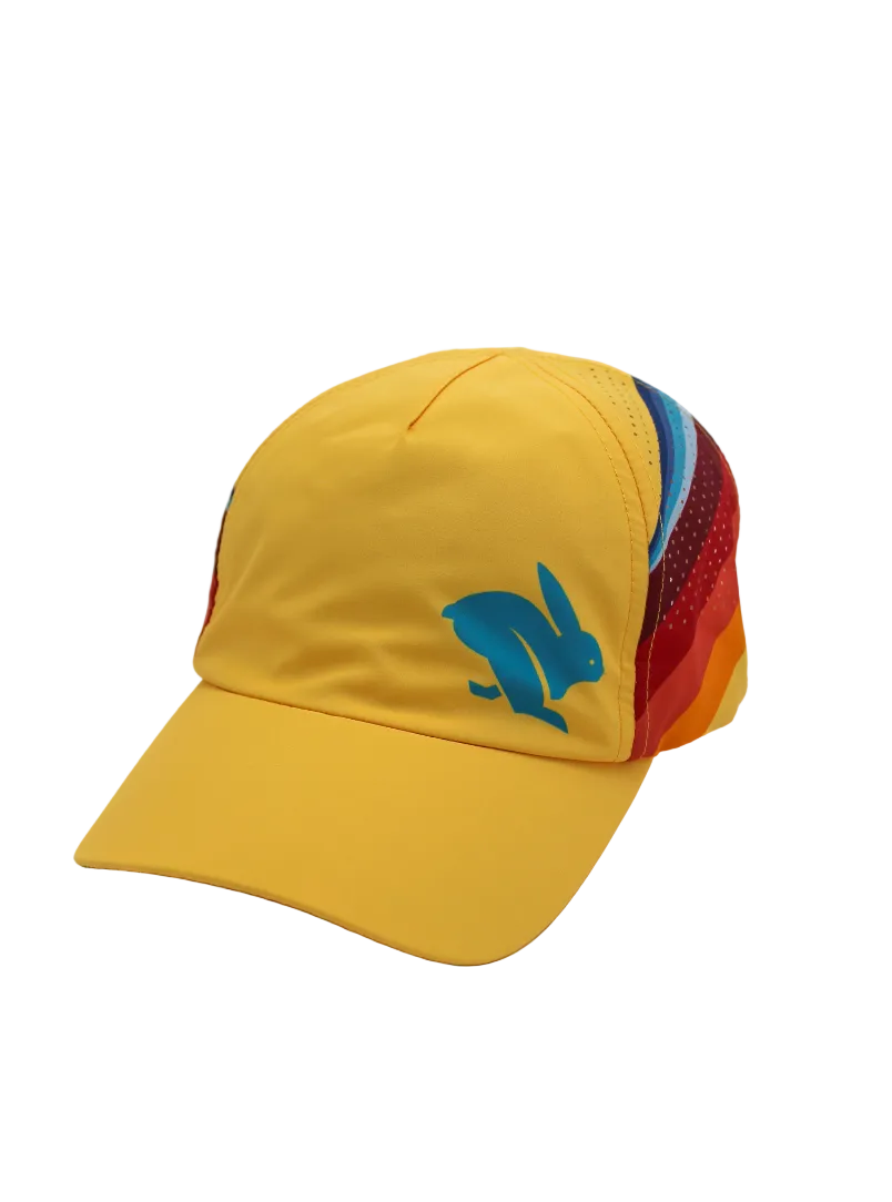Elite Hat by Rabbit in yellow with rainbow side panels, lightweight wicking cap with laser-cut vents for sun and gear protection