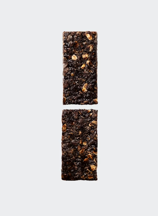 Solid C 160 by Maurten in dark brown with oats, energy bar designed for daily fuel during running, training, and outdoor activities
