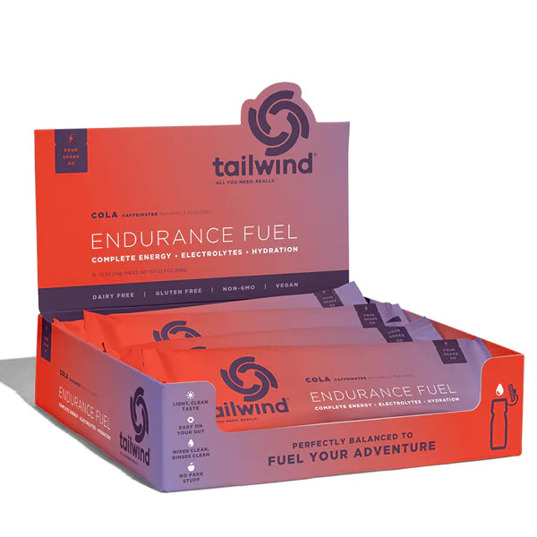 Endurance Fuel Caffeinated Singles by Tailwind in orange and purple, caffeinated nutrition with electrolytes for hydration and energy during running