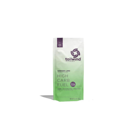 Tailwind High Carb Fuel Ginger Lime powder in green and white pouch for running energy boost with high carbohydrates and electrolytes