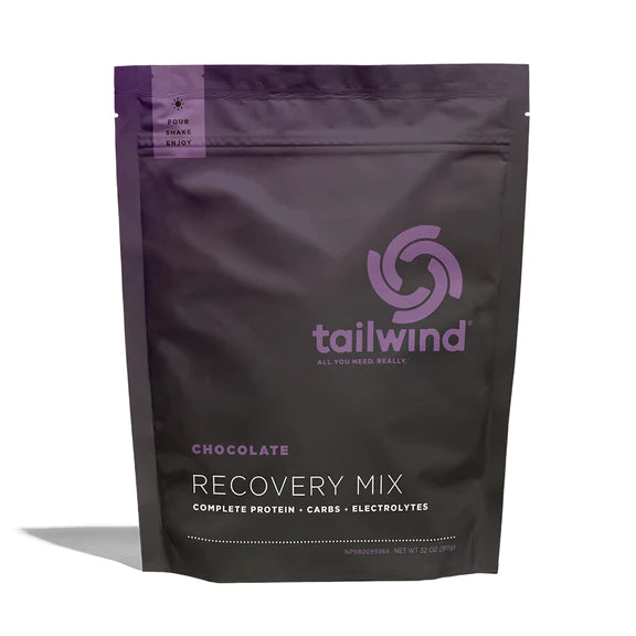 Recovery Mix 20-Serving Bag by Tailwind in dark brown with purple text, protein and electrolyte mix for post-run recovery and nutrition