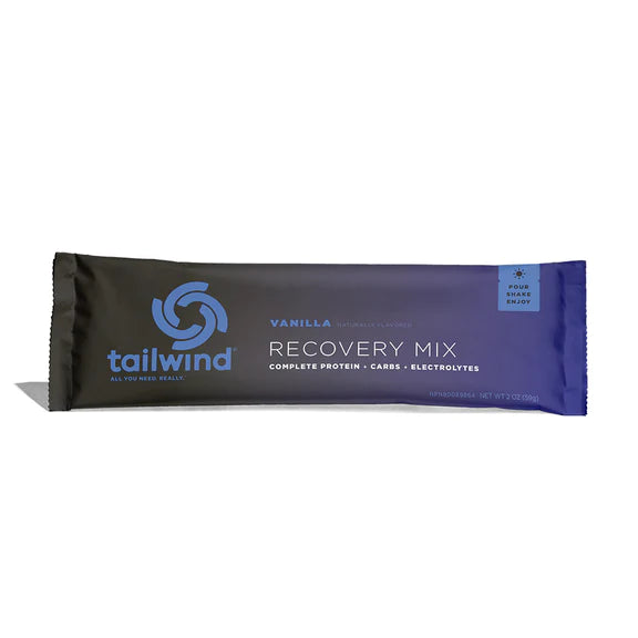 Recovery Mix Singles by Tailwind in black and purple, vanilla flavor with protein, carbs, and electrolytes for post-run recovery