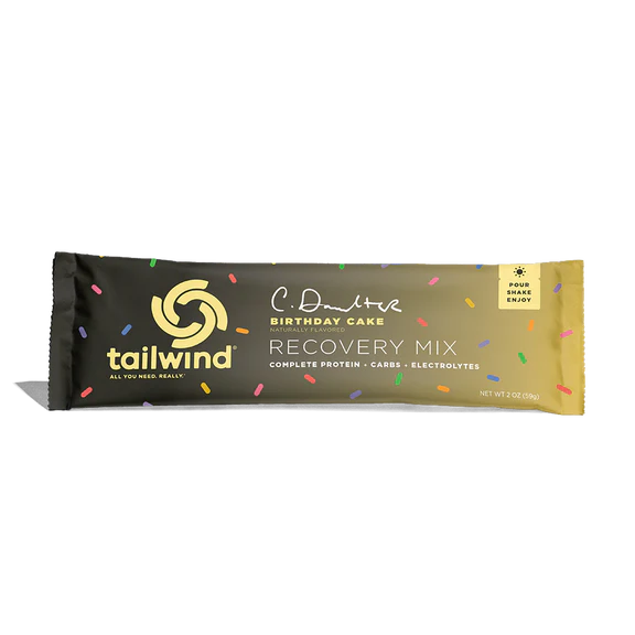 Recovery Birthday Cake (Limited Editon) by Tailwind in black and yellow packaging, protein recovery mix with carbs and electrolytes for runners