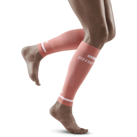 Run Compression 4.0 Calf Sleeves - Women by CEP Sports in coral pink, medi compression for calf stabilization and improved muscle supply