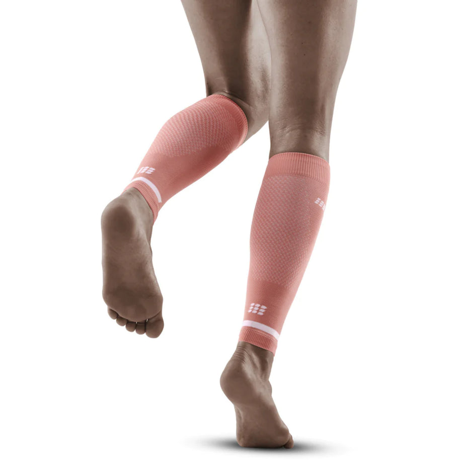 Run Compression 4.0 Calf Sleeves - Women by CEP Sports in coral pink, medi compression for calf stabilization and improved muscle activation