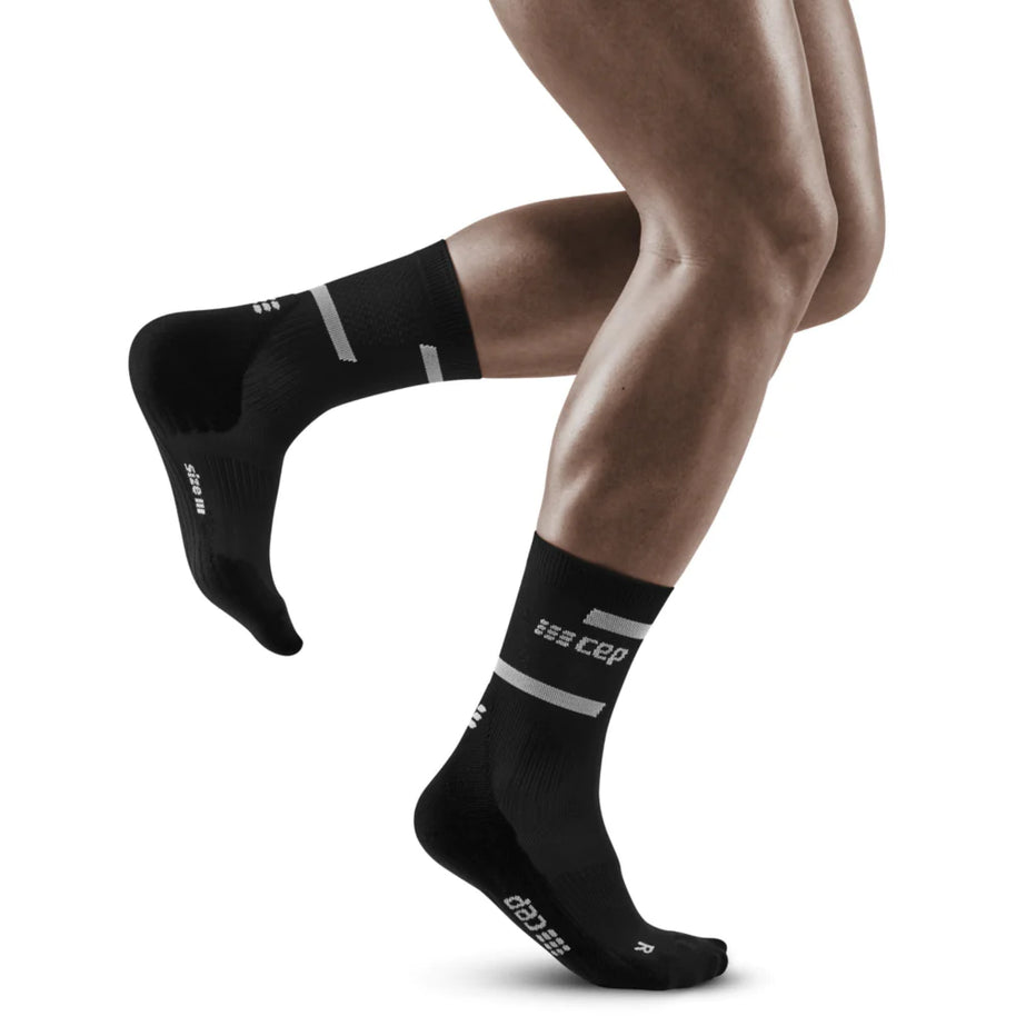 Run Compression Socks 4.0 Mid Cut - Men by CEP Sports in black, supportive socks with medi compression to stabilize joints and reduce injuries for running