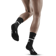 Run Compression Socks 4.0 Mid Cut - Women by CEP Sports in black, supportive socks with medi compression for joint stability and injury prevention
