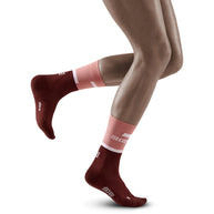 Run Compression Socks 4.0 Mid Cut - Women by CEP Sports in red and pink with medi compression for joint support and injury prevention during running