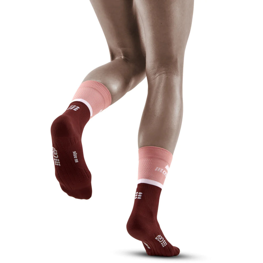 Run Compression Socks 4.0 Mid Cut - Women by CEP Sports in burgundy and pink with medi compression to stabilize joints and reduce injury