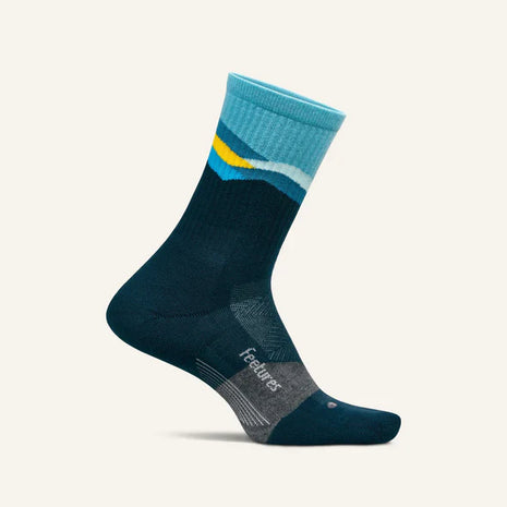 Trail Max Cushion Mini-Crew by Feetures in blue and yellow, anatomical sock with targeted compression for hiking and trail running
