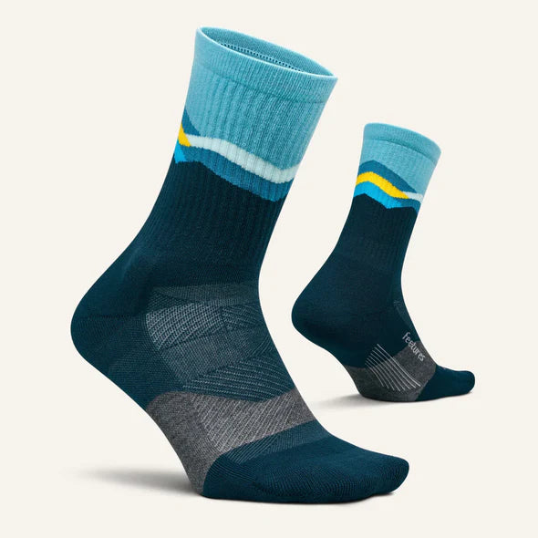 Trail Max Cushion Mini-Crew by Feetures in blue and yellow, anatomical design with targeted compression for hiking and trail running