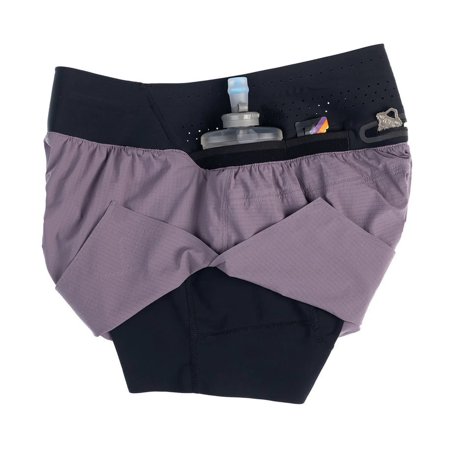 Trail Tech Short - Women by Raide Research in purple and black with hydration and nutrition storage, designed for running and outdoor use